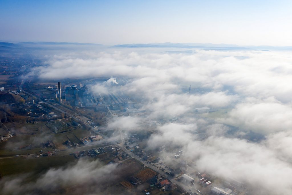 Aerial view of industrial zone covered with autumn